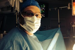 Dr. Avi Lebenthal in scrubs and surgical mask